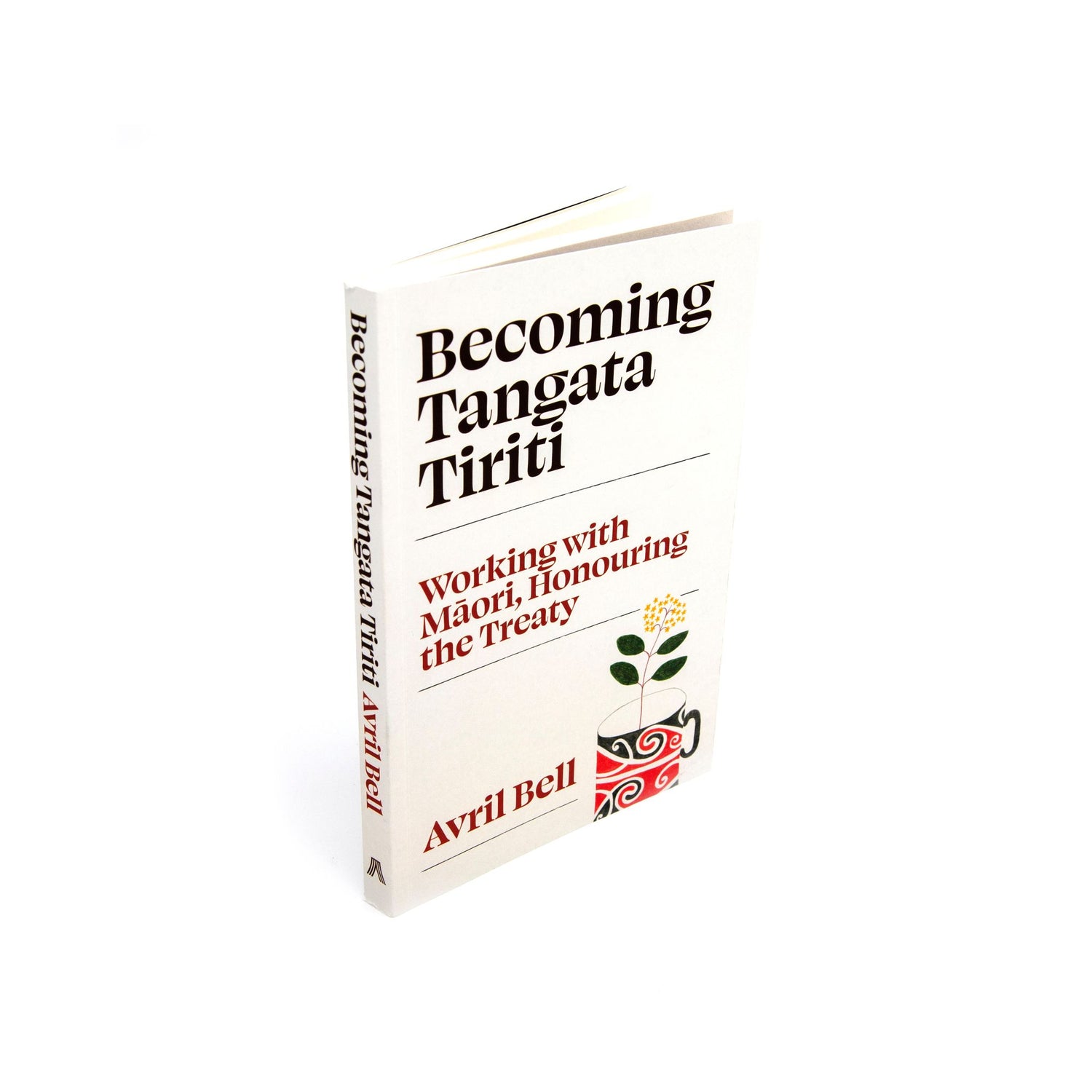 The book 'Becoming Tangata Tiriti' by Avril Bell, shown standing upright at a slight angle on a clean white background. The cover is off-white with black and red text, and a small red, green, and black floral emblem in the lower right corner.